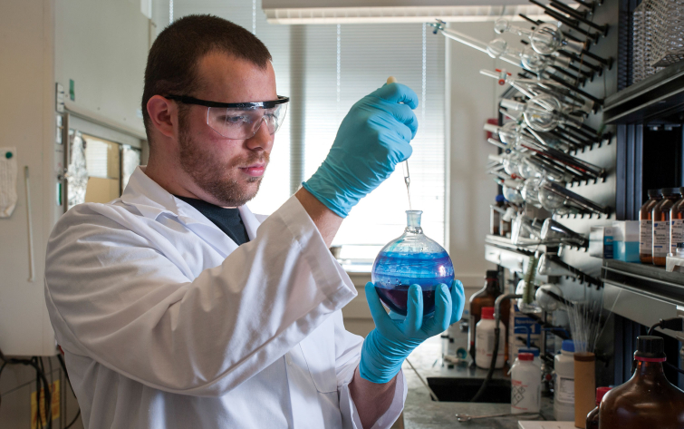 Chemical engineering student doing testing in a lab